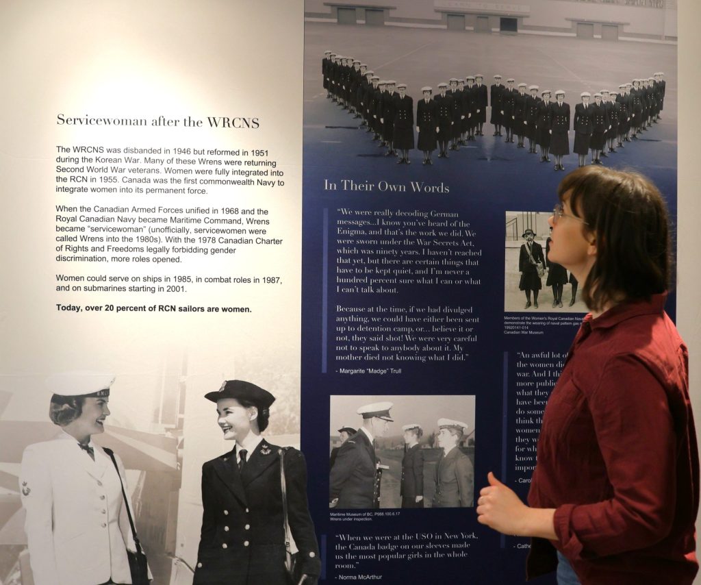 Brittany Vis, executive director, with the Getting Tiddley panels